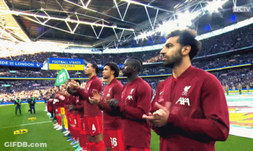 Soccer Players In Red Jerseys With Aya GIF