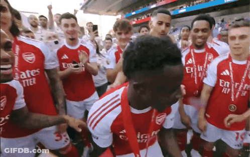 Soccer Players In Red Jerseys With Emirates Fly Better GIF