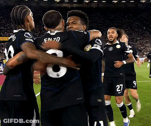 Soccer Players Including Number 27 Hugging GIF