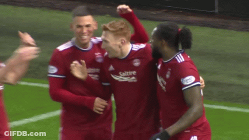 Soccer Players Including Number 8 Hugging GIF