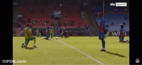 Soccer Players Kneeling On Field GIF