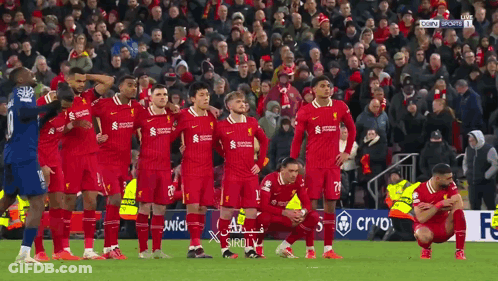 Soccer Players Kneeling On Field With Crowd GIF