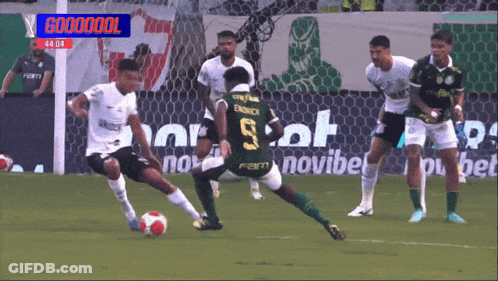 Soccer Players On A Field With A Banner That Says Coooooool GIF