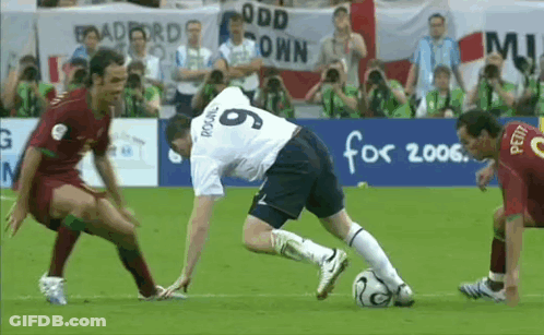 Soccer Players On A Field With A Banner That Says Odd Town GIF