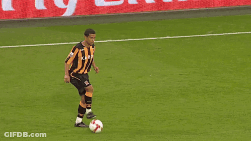 Soccer Players On A Field With A Fly Emirates Banner GIF