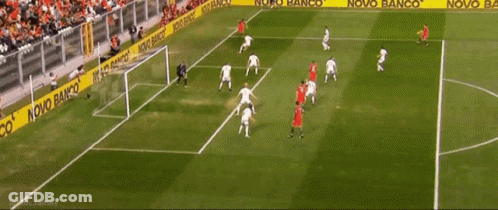 Soccer Players On A Field With A Novo Banco Banner Behind Them GIF