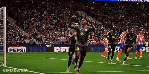 Soccer Players On A Field With A Pepsi Ad GIF