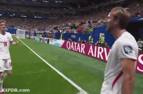 Soccer Players On A Field With A Qatar Airv Banner GIF