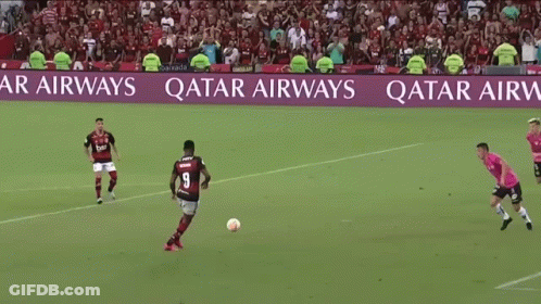 Soccer Players On A Field With A Qatar Airways Banner In The Background GIF