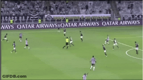 Soccer Players On A Field With A Qatar Airways Banner In The Background GIF