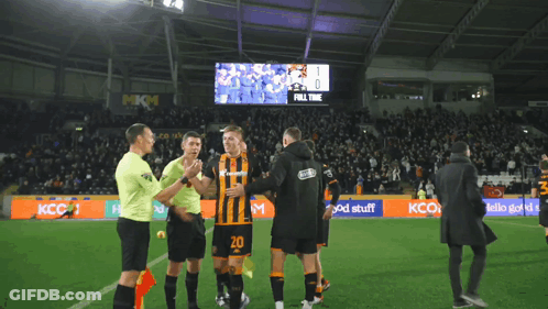 Soccer Players On A Field With A Scoreboard That Says " Full Time " On It GIF
