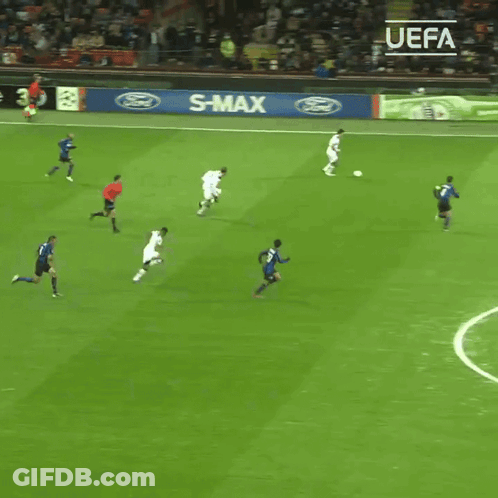 Soccer Players On A Field With A Sign That Says Enjoy Responsibly On It GIF
