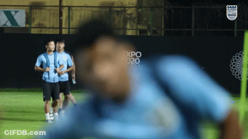 Soccer Players On A Field With A Sign That Says Expo 2020 On It GIF