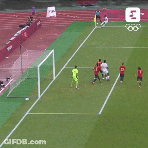 Soccer Players On A Field With A Sign That Says Tokyo 2020 On It GIF