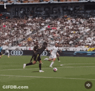Soccer Players On A Field With An Audi Ad GIF