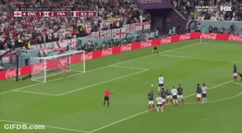 Soccer Players On A Field With Coca Cola Advertisements On The Sidelines GIF