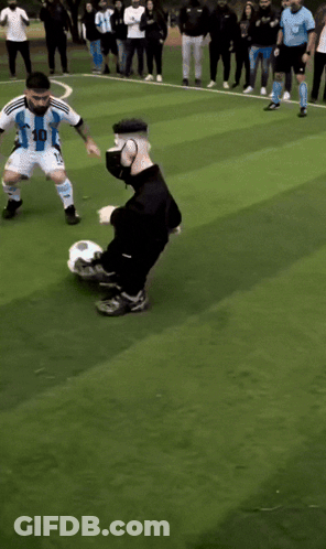 Soccer Players On A Field With One Wearing A Blue Shirt GIF