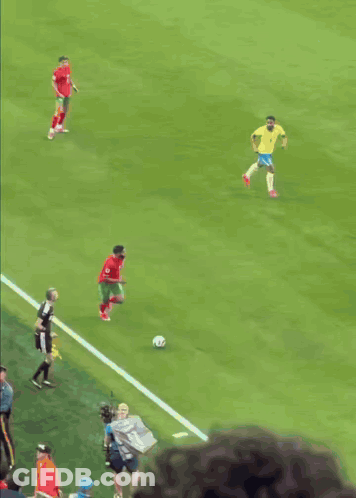 Soccer Players On A Field With One Wearing A Red Jersey With The Number 11 On It GIF