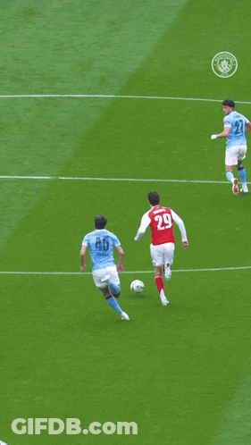 Soccer Players On A Field With One Wearing The Number 33 GIF