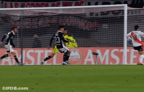 Soccer Players On Field In Front Of Amstel Sign GIF