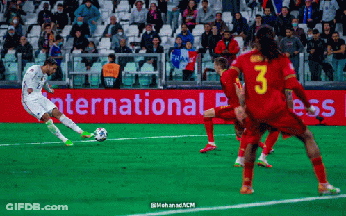Soccer Players On Field In Front Of International Press Sign GIF