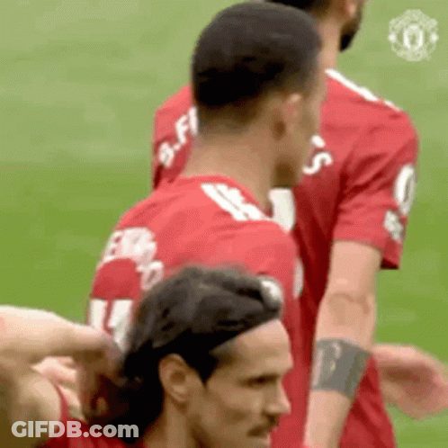 Soccer Players On Field One Pointing At Camera GIF