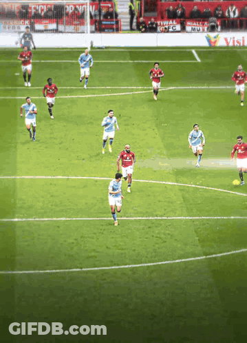 Soccer Players On Field One Pointing At Camera GIF