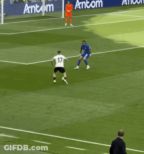 Soccer Players On Field With Antcom Banner GIF