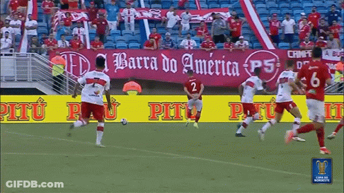 Soccer Players On Field With Barra Do America Banner GIF