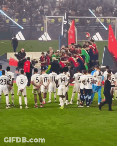 Soccer Players On Field With Blue Sign Kinza GIF