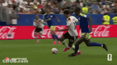 Soccer Players On Field With Coca Cola Advertisements GIF