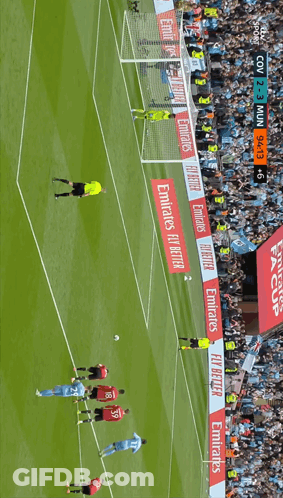 Soccer Players On Field With Emirates Banners GIF