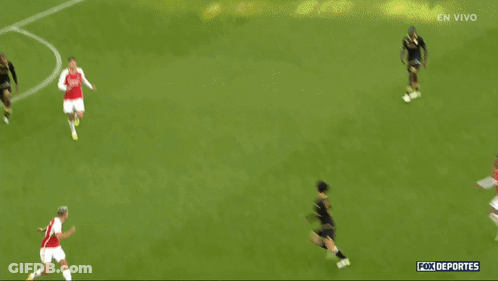 Soccer Players On Field With En Vivo GIF
