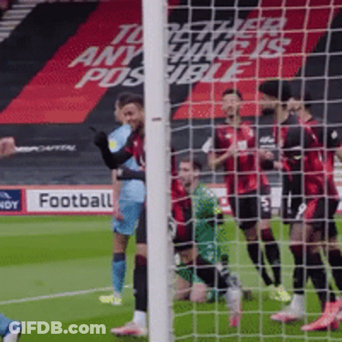 Soccer Players On Field With Football Sign GIF