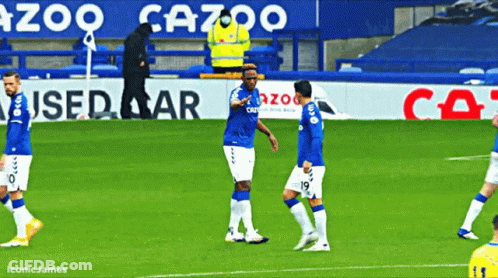 Soccer Players On Field With Gazoo Sign GIF