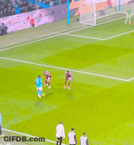 Soccer Players On Field With Goalkeeper GIF