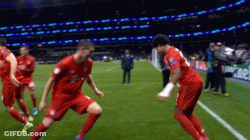 Soccer Players On Field With Heineken Shirt GIF