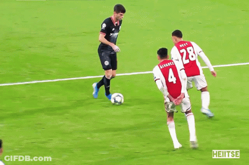 Soccer Players On Field With Lays Ad GIF