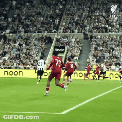 Soccer Players On Field With Noon Sign GIF