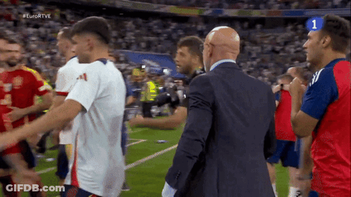 Soccer Players On Field With Number 1 GIF