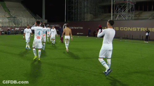 Soccer Players On Field With Number 4 Jersey GIF