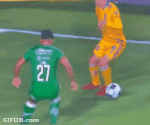Soccer Players On Field With Number 9 Mascot GIF