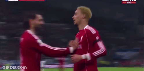 Soccer Players On Field With Pepsi Sign GIF