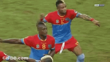 Soccer Players On Field With Referee GIF