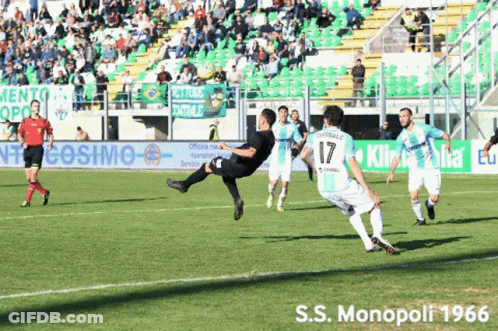 Soccer Players On Field With S.S. Monopoli 1966 Banner GIF