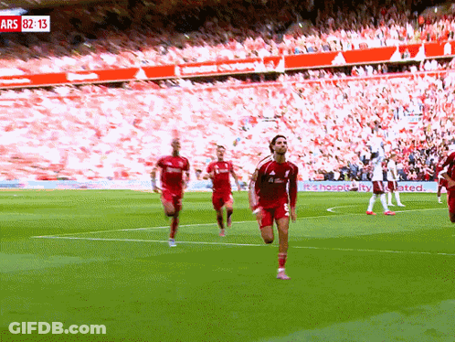 Soccer Players On Field With Sign Ars 82:13 GIF