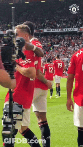 Soccer Players On Field With Sir Alex 26 Years Sign GIF