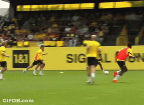 Soccer Players On Field With T & T Sign GIF
