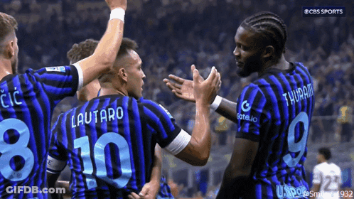 Soccer Players On Field With T & T Sign GIF