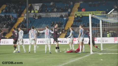 Soccer Players On Field With Turnbulls Tyres Sign GIF